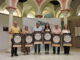 Los participantes en el acto de presentación en la Casa de la Provincia, con el cartel de la XI Ruta de la Tapa de Benacazón.